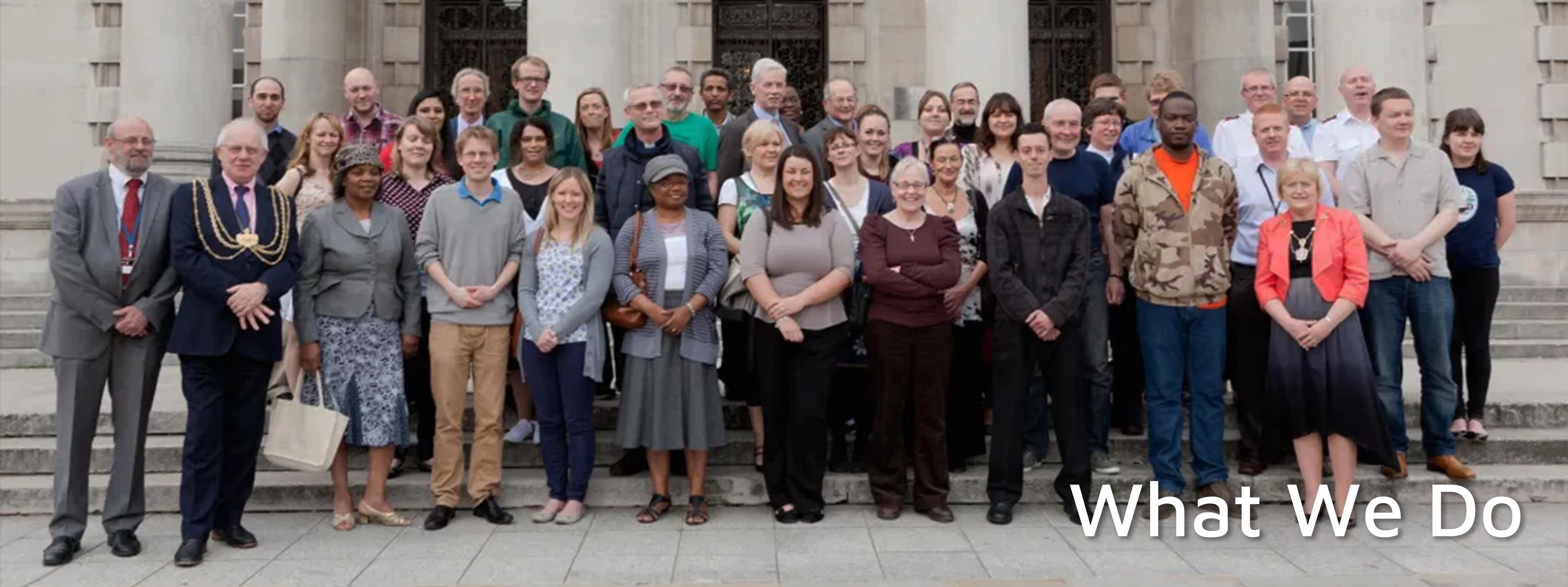 The people involved with Leeds Food Aid Network with 'What We Do' overlaid.